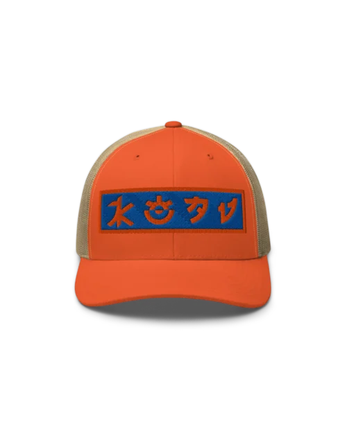 Front side view of the Crafted 6-panel KOAV Retro Badge trucker cap in Orange with a Khaki mesh back. Featuring a retro KOAV word mark badge in orange and cobalt blue stitch embroidery on the front.